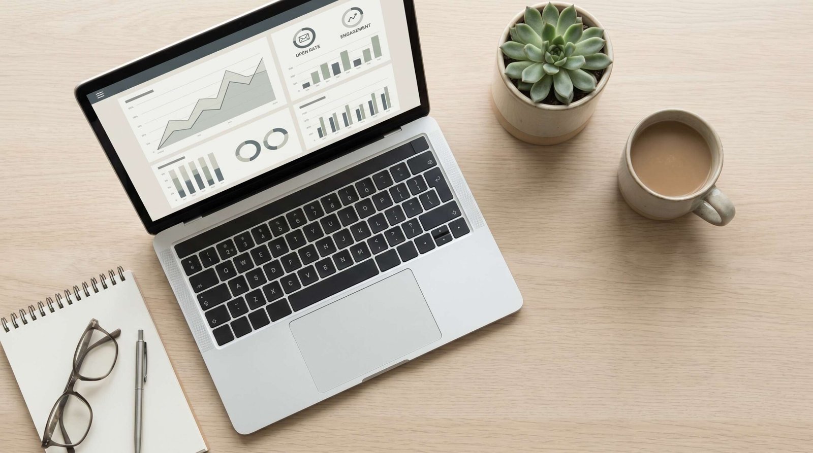 Marketing professional reviewing SaaS email campaign analytics on a large monitor, showing open rates and conversion data
